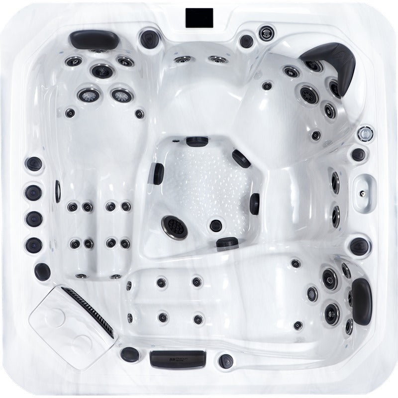 Top view of the Platinum Spas Kenya hot tub with clear seating and lounger arrangement, precisely positioned massage jets and structured floor surface - sophisticated design for holistic relaxation.